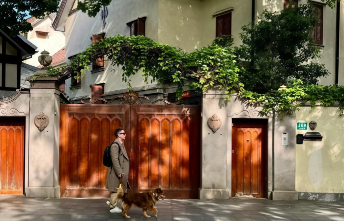 Pedestrians strolling along a quiet street in Shanghai