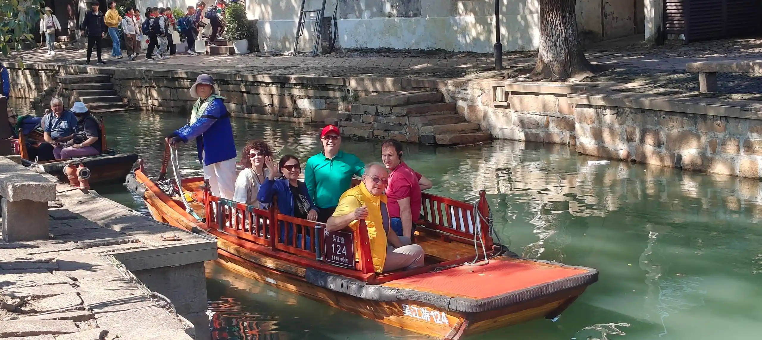Into Travel China guests enjoying a traditional boat ride
