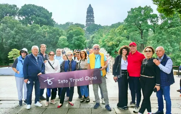Into Travel China guests visiting a historic pagoda